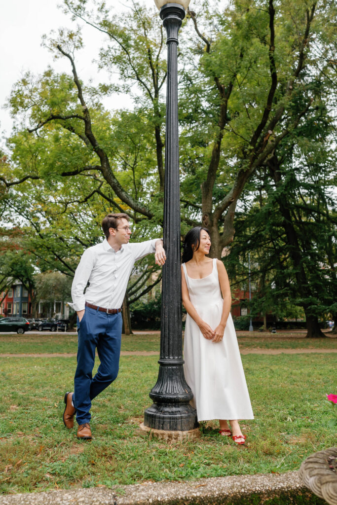 Couple standing near historic lamppost during Capitol Hill Washington DC engagement session