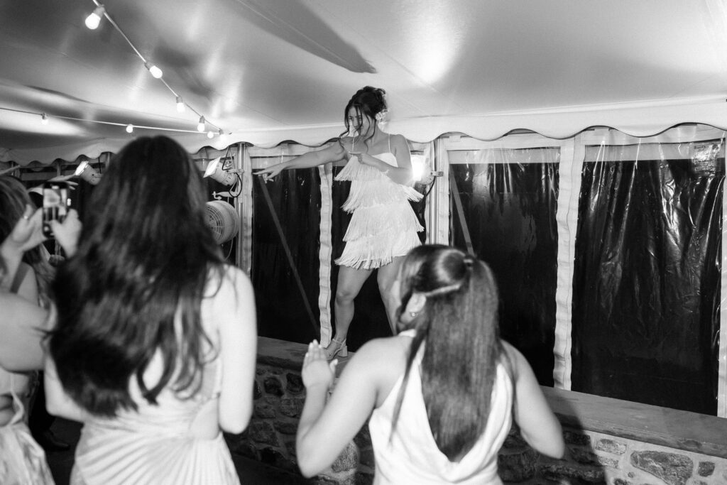 Joyful dance floor moment during the Appleford Estate wedding reception as the bride celebrates with guests late into the evening.