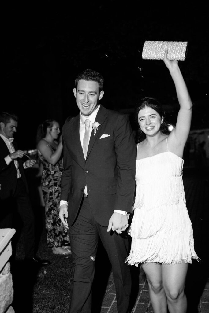 bride and groom exit wedding reception