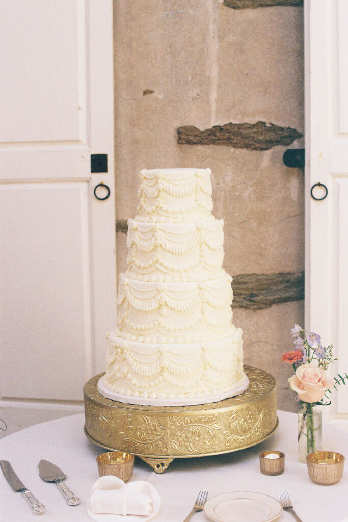 Elegant wedding cake displayed during the Appleford Estate reception celebration.