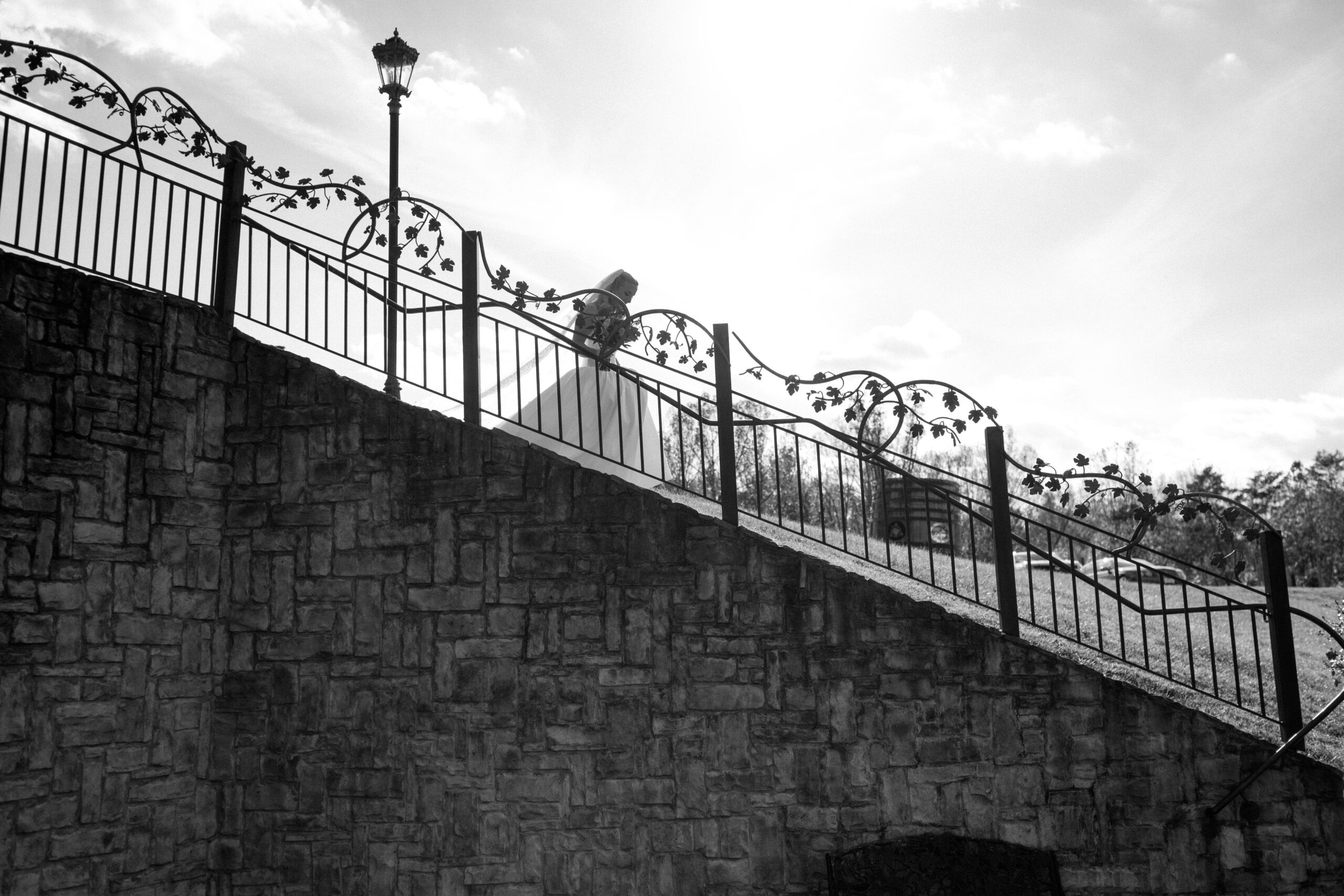 Bride walking to first look before her wedding at Potomac Point Winery in Virginia, photographed by Untamed Hearts Photo Co